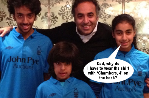 Fawaz and family pose in Forest shirts